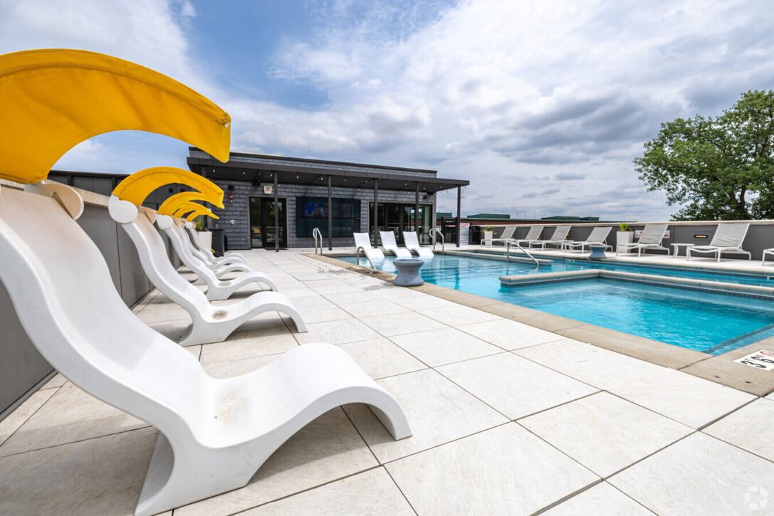 Modern apartment rooftop pool deck with porcelain paver system St Louis 1400 Russell