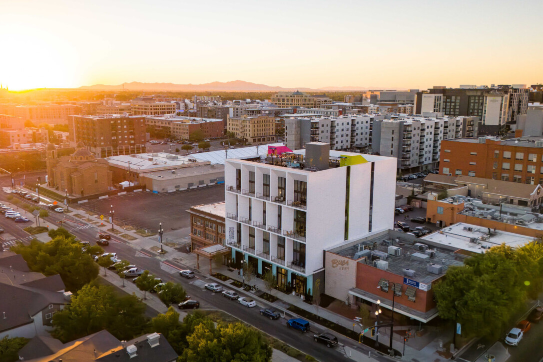 Aerial exterior view of Aperture Residences and its rooftop amenity deck in Salt Lake City, Utah